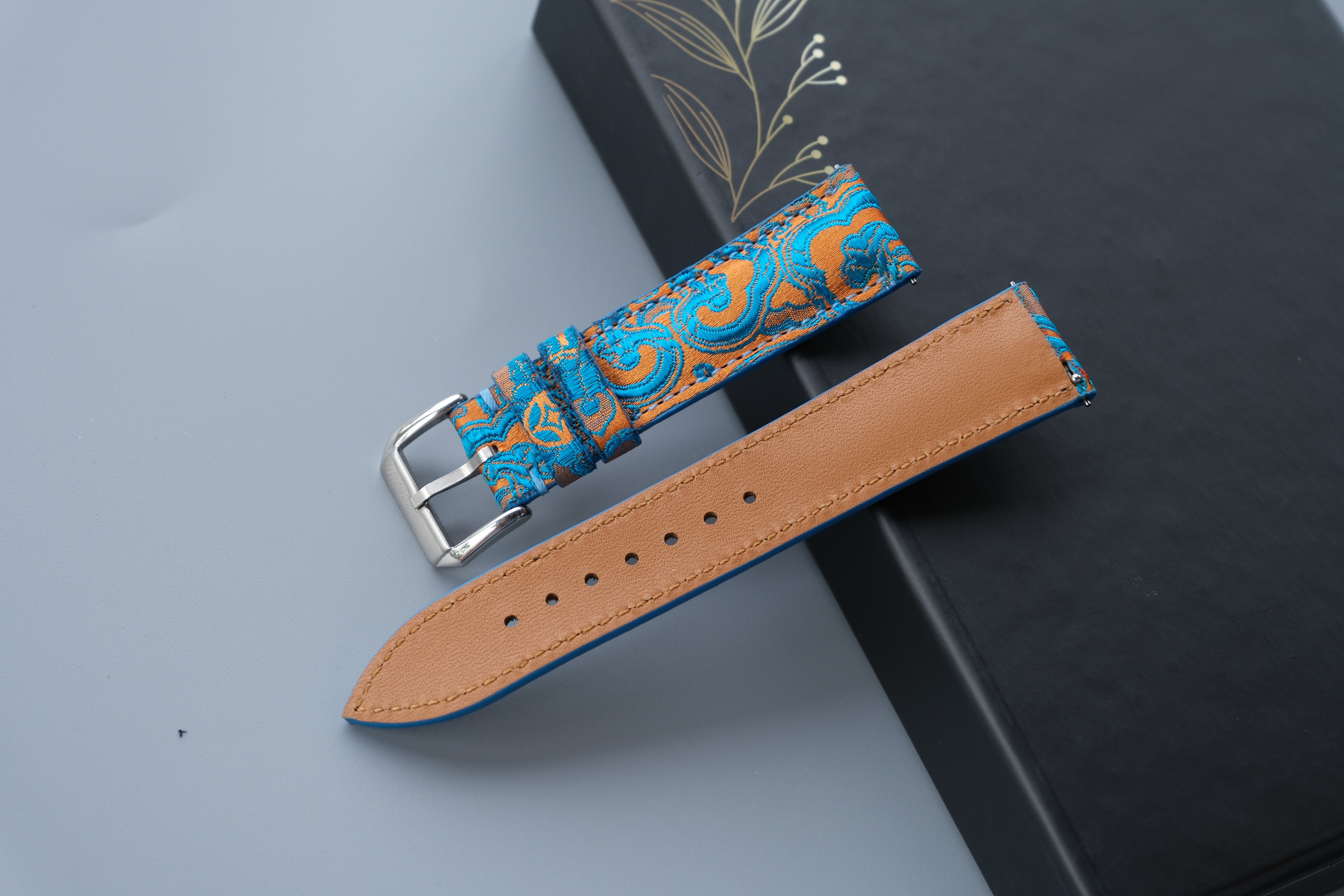 Turquoise Silk Fabric Watch Strap With A Patterned Design