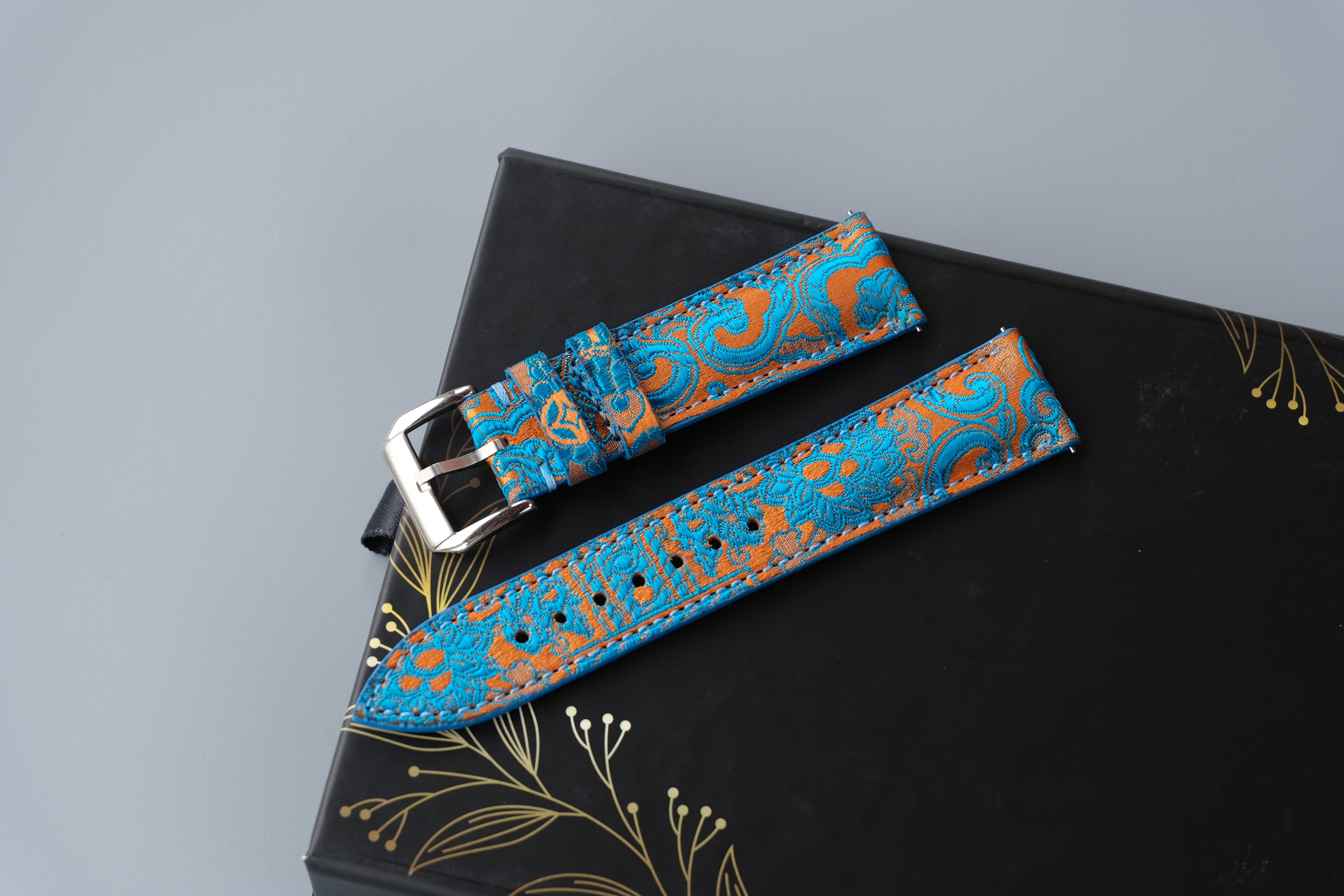 Turquoise Silk Fabric Watch Strap With A Patterned Design