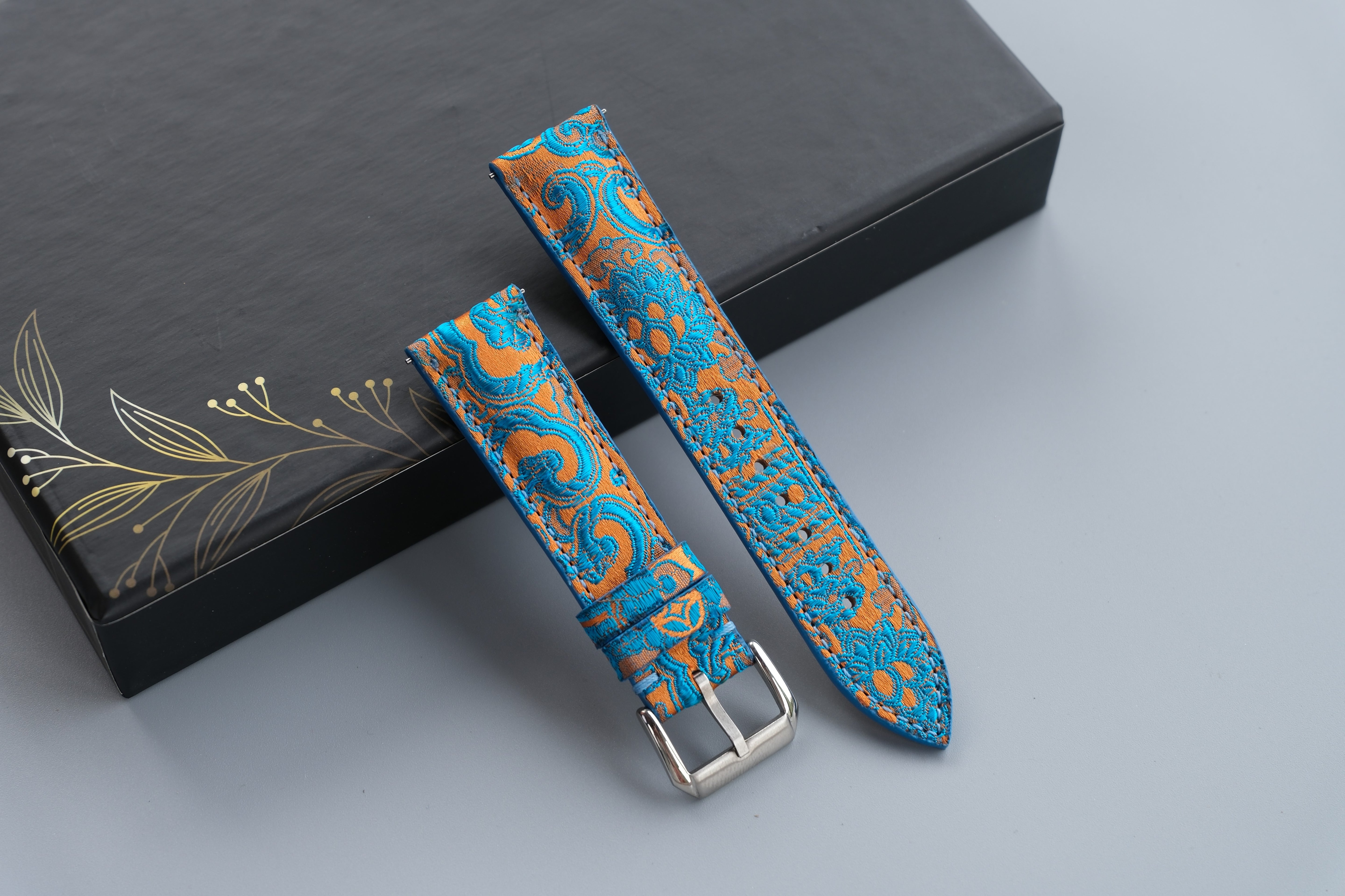 Turquoise Silk Fabric Watch Strap With A Patterned Design