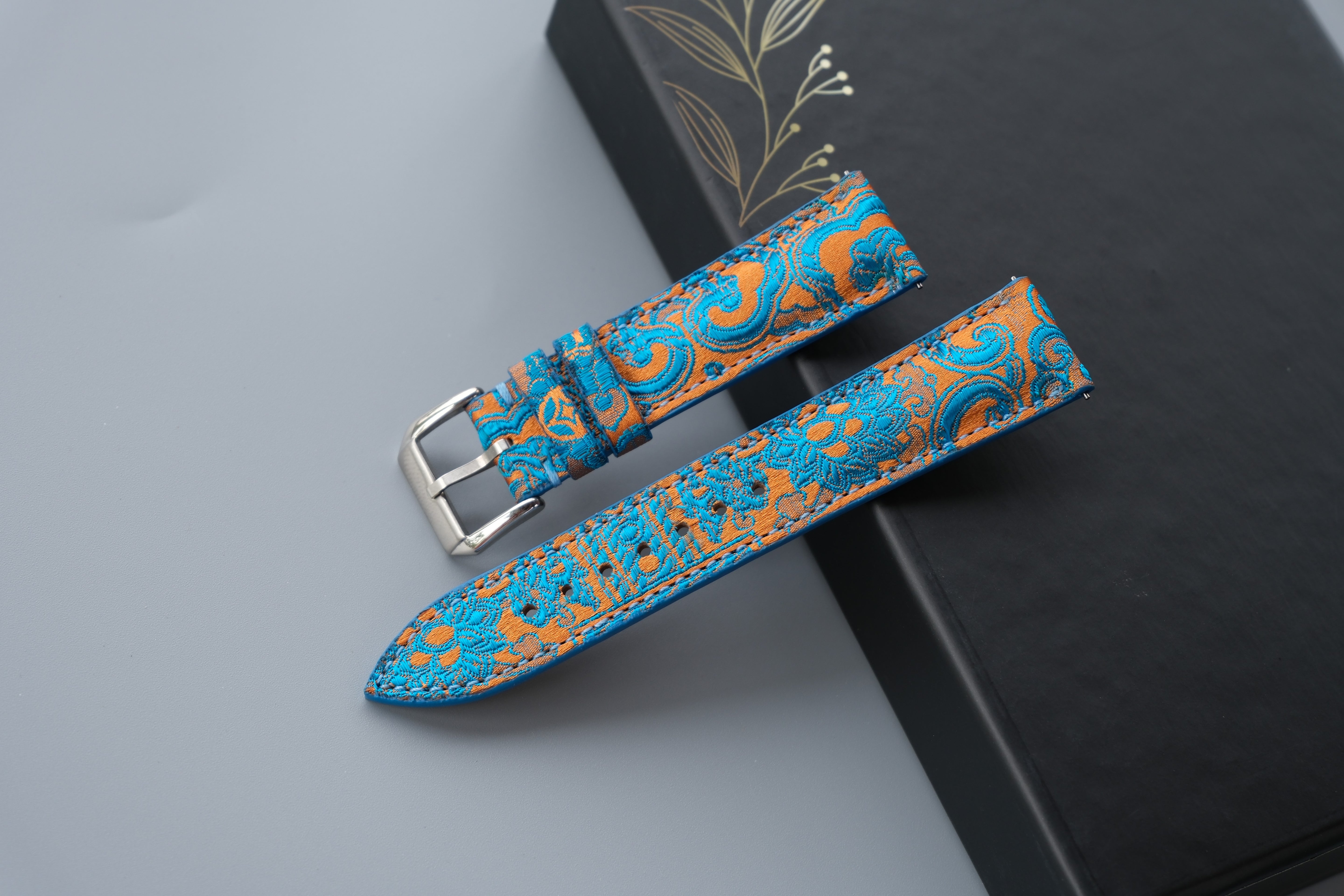 Turquoise Silk Fabric Watch Strap With A Patterned Design