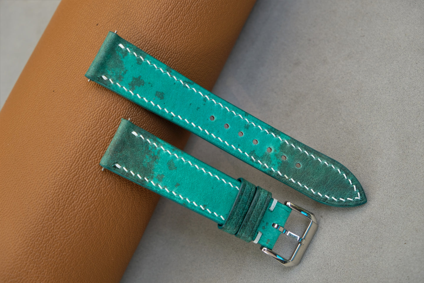 The Watch Strap Is Made From Green Bullfrog Leather