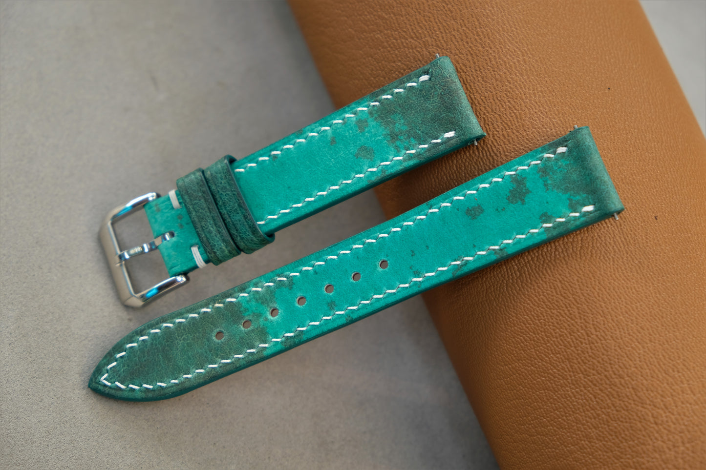 The Watch Strap Is Made From Green Bullfrog Leather