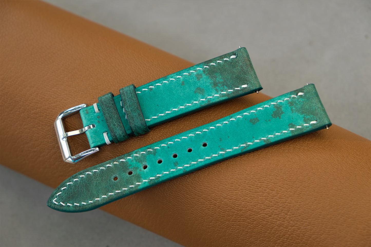 The Watch Strap Is Made From Green Bullfrog Leather