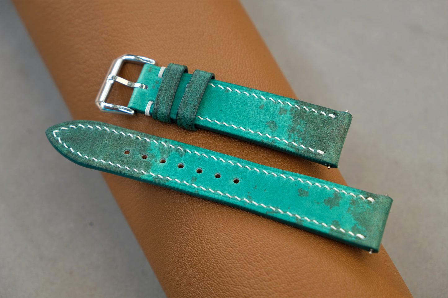 The Watch Strap Is Made From Green Bullfrog Leather